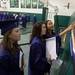 Graduates look at their class photo after their graduation ceremony, Thursday June 6. Courtney Sacco I AnnArbor.com